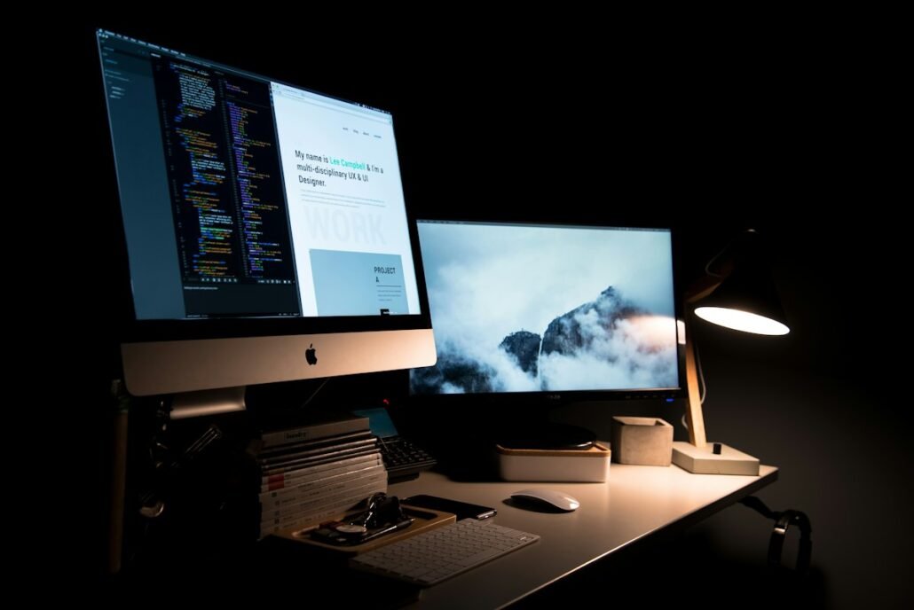 Designer portfolio website on a desk